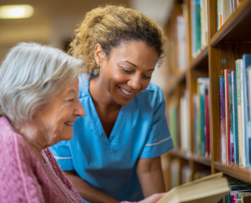 A happy woman with her caregiver providing home care services in Blackpool