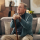 An elderly man at home reflecting quietly, representing the importance of dementia training for care homes in supporting emotional wellbeing and dignity.