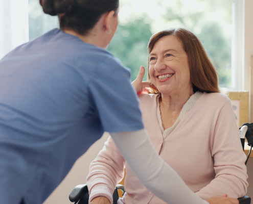 Dementia training for carers in action as a specialist supports an elderly person at home